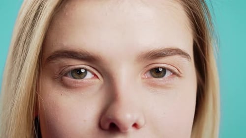 Half Face with Green Eyes Eyebrows Nose Pretty Healthy Skin Charming Young Woman with Natural Beauty