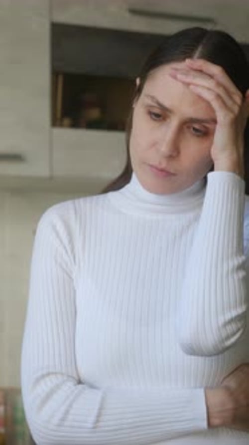 Worried Woman Suffering From Headache and Stress