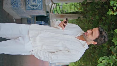 Relaxed Brunette Ending Call Phone Strolling Alley Vertical Man Waiting Alone