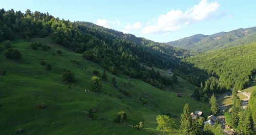 Aerial View Of Green Mountain With Trees, Forest And Houses.