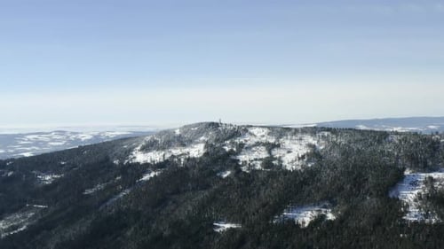 Snowy Mountain Range Under a Serene Blue Sky