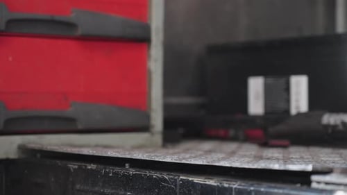 Put a briefcase in a car and close the door