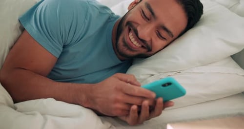Relax, bed and man typing with phone while chatting on text message with social media app
