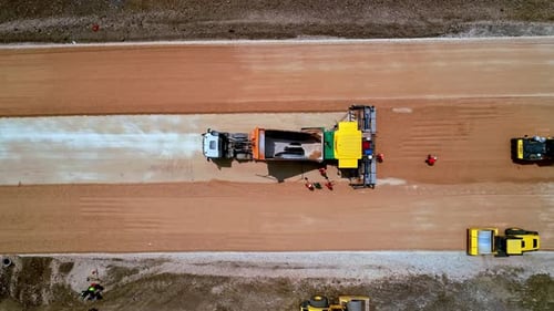 Aerial Top View of Road Base Construction with Heavy Machinery