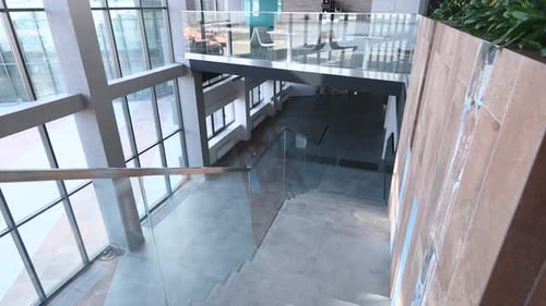Stylish and Modern Office Building Lobby Interior Large Panoramic Windows and Stairs with