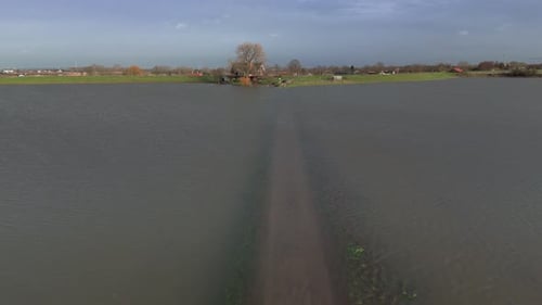 Submerged road Along the Flooded Riverbanks