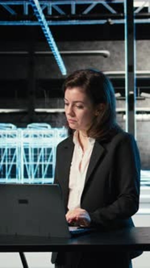 Vertical Video Data Center Female Programmer Uses Laptop and AR Virtualization