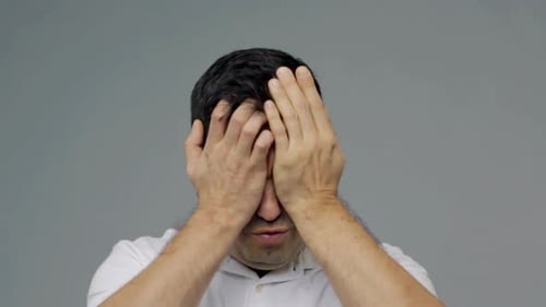 Man with severe headache or emotional distress