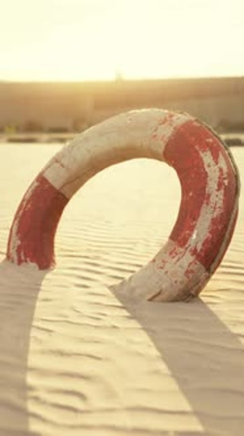 Lifebuoy on the City Beach at Sunset