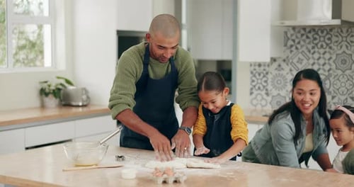 Family Baking Together in Bright Kitchen