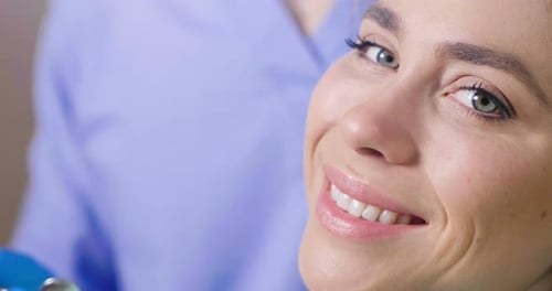 In a professional practice, a dentist checks the dentition of the patient, and she is happy with t
