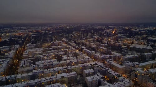 Berlin City lights, rooftops covering in snow winter at dusk. Brilliant aerial viewdrone
