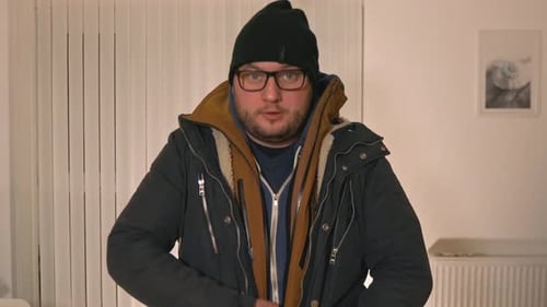 Man Zips Up Warm Blue Winter Jacket Inside