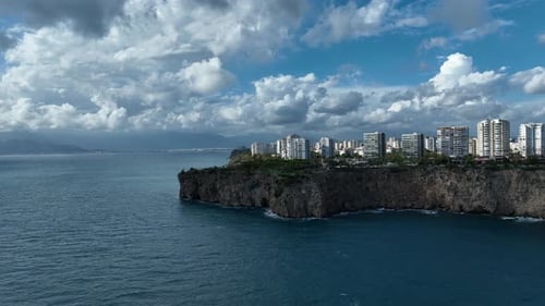 High-angle aerial view from the sea revealing Antalya’s coastline and beachfront areas.