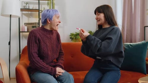 Two Women Celebrate Positive Pregnancy Test at Home