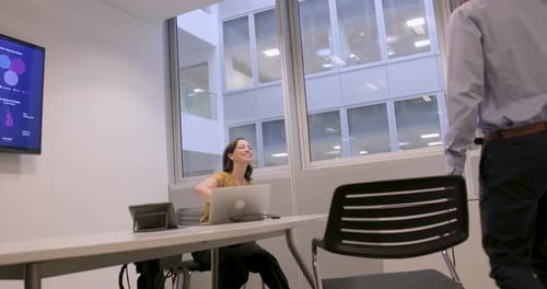 Two Professionals Business people Shaking Hands in Office