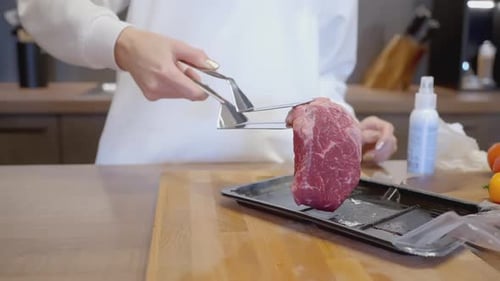 Preparing Raw Beef in Frying Pan