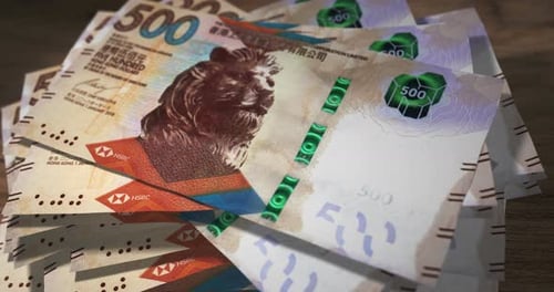 Hong Kong Dollar 500 money banknotes falling on the table