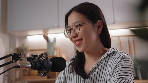 Young Woman Recording a Podcast in Home Studio