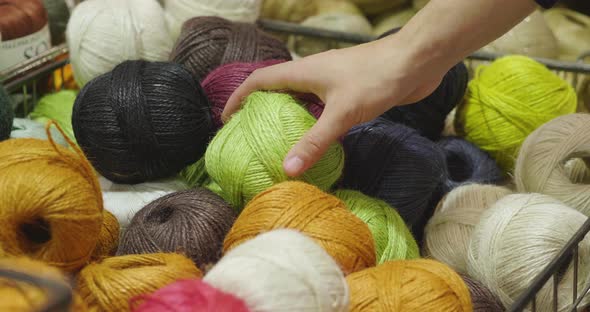 Close up of a hand touching raw, warm and soft wool. Concept of ...
