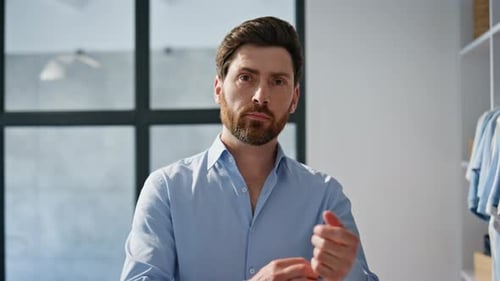 Man Buttoning Dress Shirt Close Up Indoors