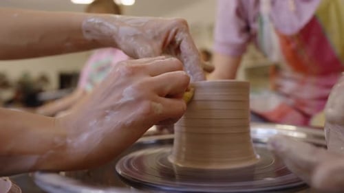 Pottery Workshop at a Local Studio Showcasing Wheel Throwing Skills