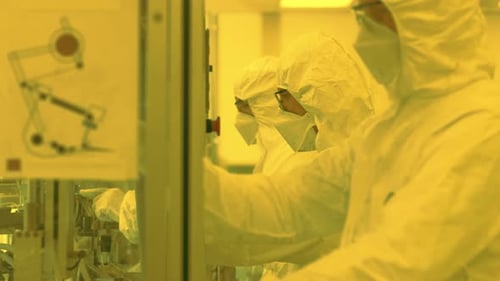 Sterile High Precision Manufacturing Laboratory where Scientists in Protective Coverall's Manufactu