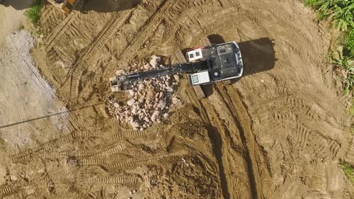 Aerial View Construction Crew Shapes Metal and Builds Foundation