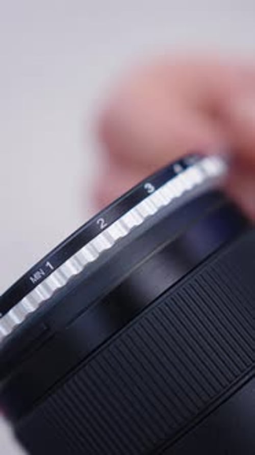 Vertical close up of variable nd filter strength numeration attached on lens