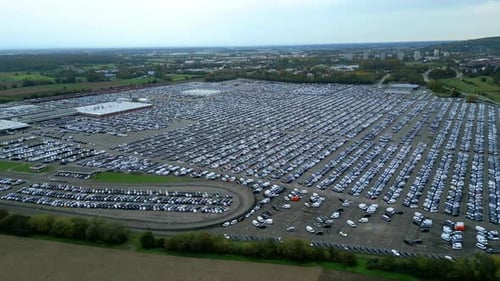 Many cars on a parking lot from above, filmed with a drone in 4k, parked cars