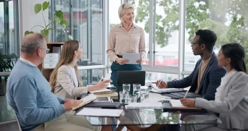 Diverse Group Meeting Led By Woman in Office