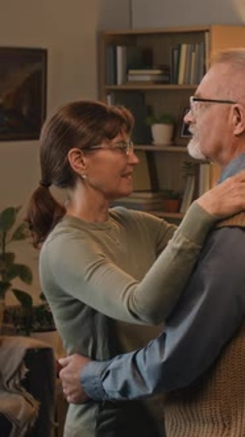 Loving Senior Couple Dancing Together in Home