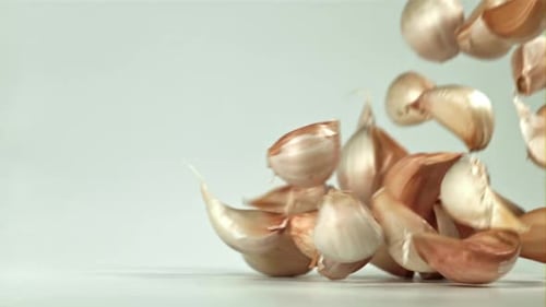 Fresh Garlic Falls on the Table Filmed on a Highspeed Camera at 1000 Fps
