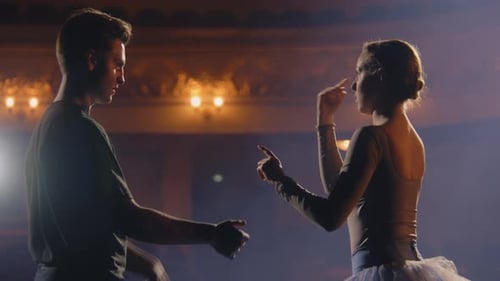 Ballet Dancers Practice Ballet Lifts on Theater Stage