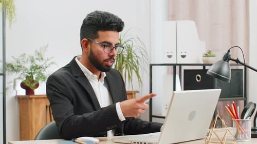 Angry Businessman CEO Making Laptop Call Conversation at Home Office Quarrel Conflict Negotiation