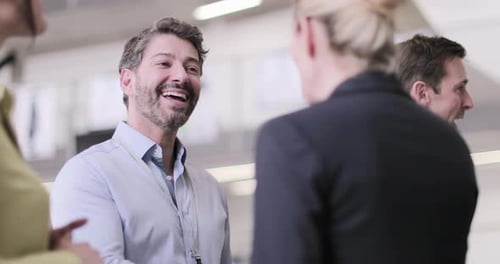 Business Professionals Talking in Bright Corporate Environment