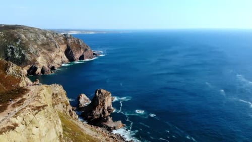 Seaside Cliffs With Turquoise Waters And Rocks Stunning Aerial Shot Of Rugged Shoreline With Calm