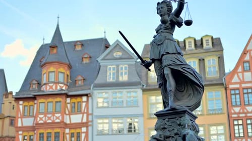 Justice fountain square statue and buildings in Frankfurt, Germany