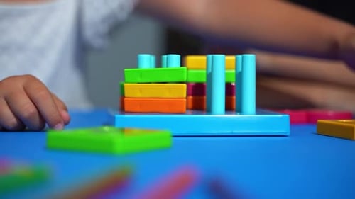Closeup Children Hand Fingers Developing Fine Motor Skills Tackle Puzzle Logical Games for Young
