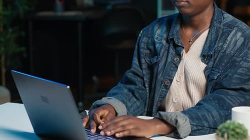 Woman Sitting at Home Office Desk Typing on Laptop Keyboard Close Up