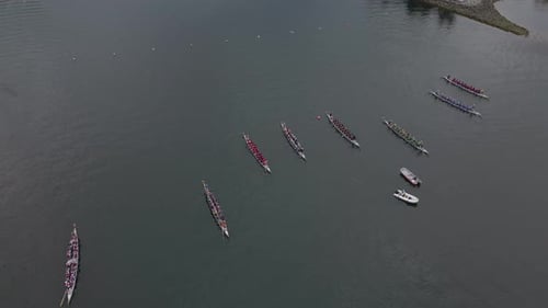 Dragon boats lining up to race