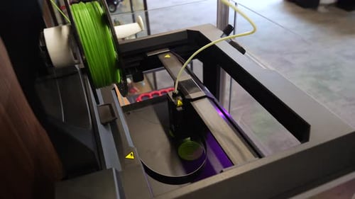 Ultramodern 3D printer working on a project. Close-up shot