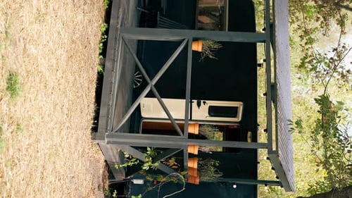 vertical video A mobile home with a terrace is located in country glamping site for relaxation