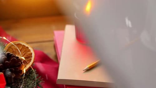 Festive Holiday Still Life with Candle and Books