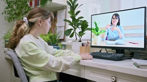 Teenager Attends Online Class at Home