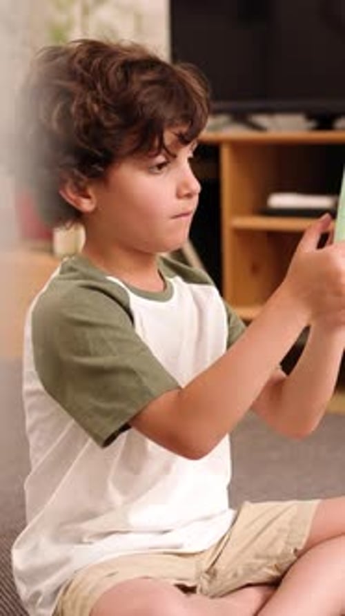 Young Boy Holds Phone Inside