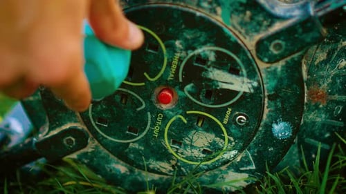 Hand Plugs Cord into Outdoor Power Outlet