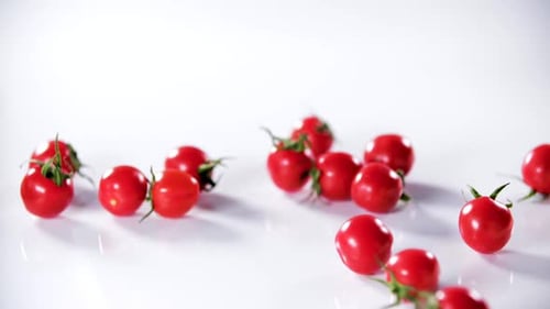 Fresh Red Cherry Tomatoes on a White Surface