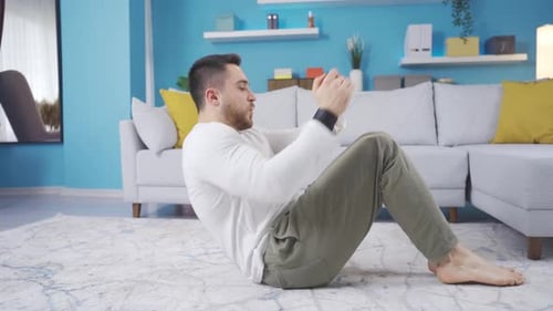 Young Adult Doing Sit-ups at Home
