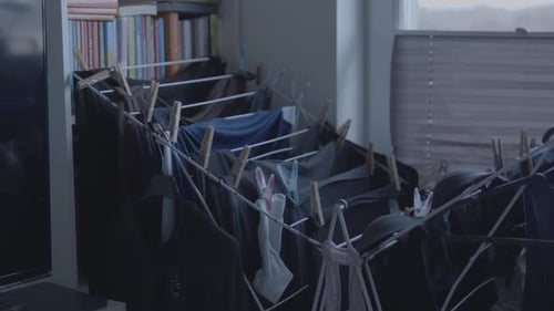 Clothes drying on a rack in a room